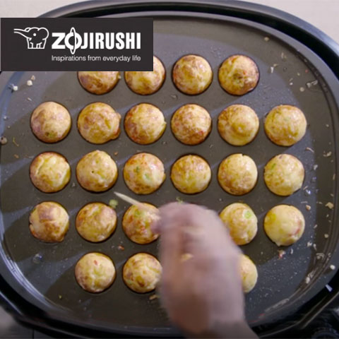 Learn how to make <i>takoyaki</i>  in the video below