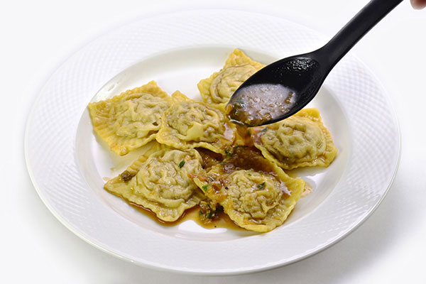 
              Roasted Chicken and Porcini Mushroom Ravioli with Sherry Sauce Step 9
      	