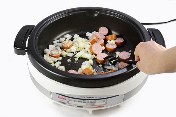 
              One Pot Tomato Sausage Penne Step 1
      	