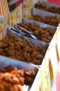 Japanese festival stand offering five different types of fried chicken karaage.