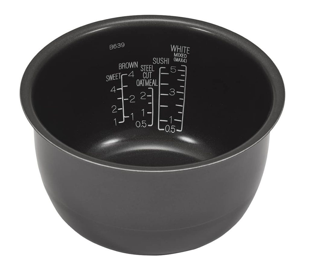 Rice cooking pan showing the white water measuring lines 