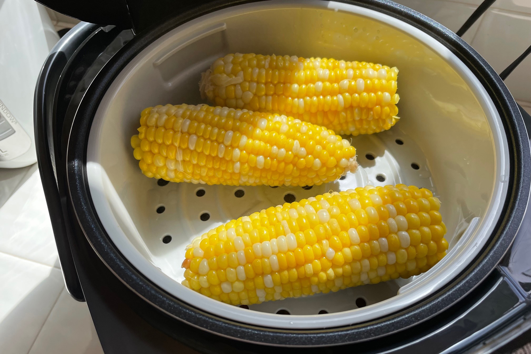 Steaming basket with delicious corn