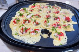 Takoyaki cooking on hot plate