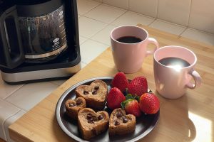 heart shaped cookies on dish with strawberries