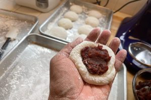 making mochi with red bean paste