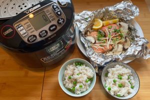 foil salmon with rice cooker, two bowls of rice with peas