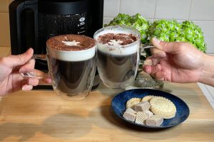 Irish coffee glasses in a toast