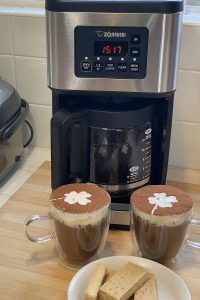 Irish coffee next to coffee maker