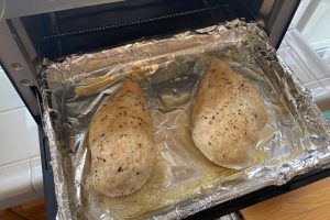 Two chicken breasts cooked in oven toaster
