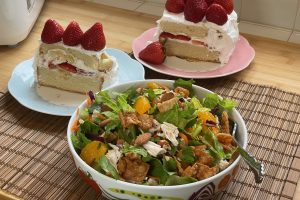 cakes in background and salad in front