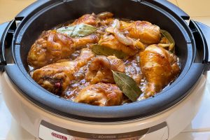 chicken pieces cooking in skillet