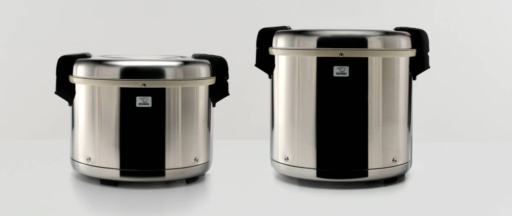 Two Zojirushi's Professional Rice Warmer with white background