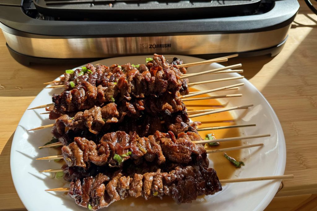 stack of teriyaki sticks on plate