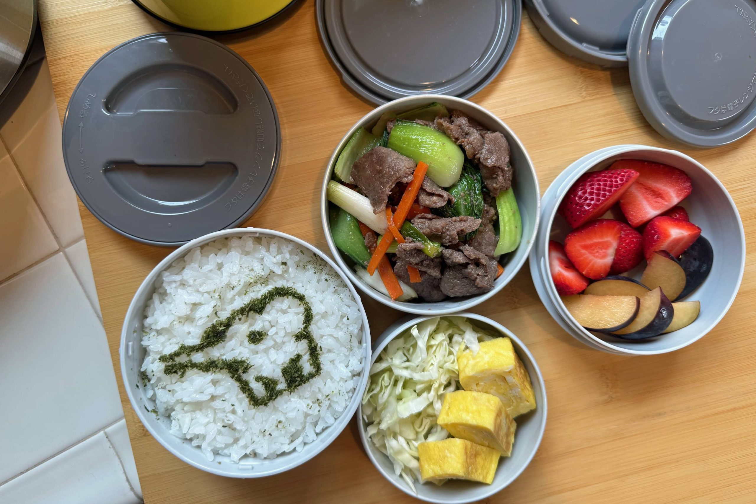 Bento with beef stir-fry, flavored eggs, fruit and rice in Mr. Bento kit