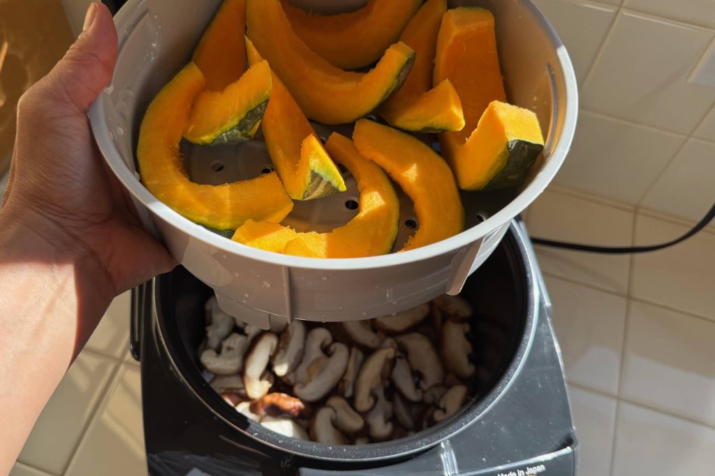 Japanese pumpkin (kabocha) preparing to steam in rice cooker