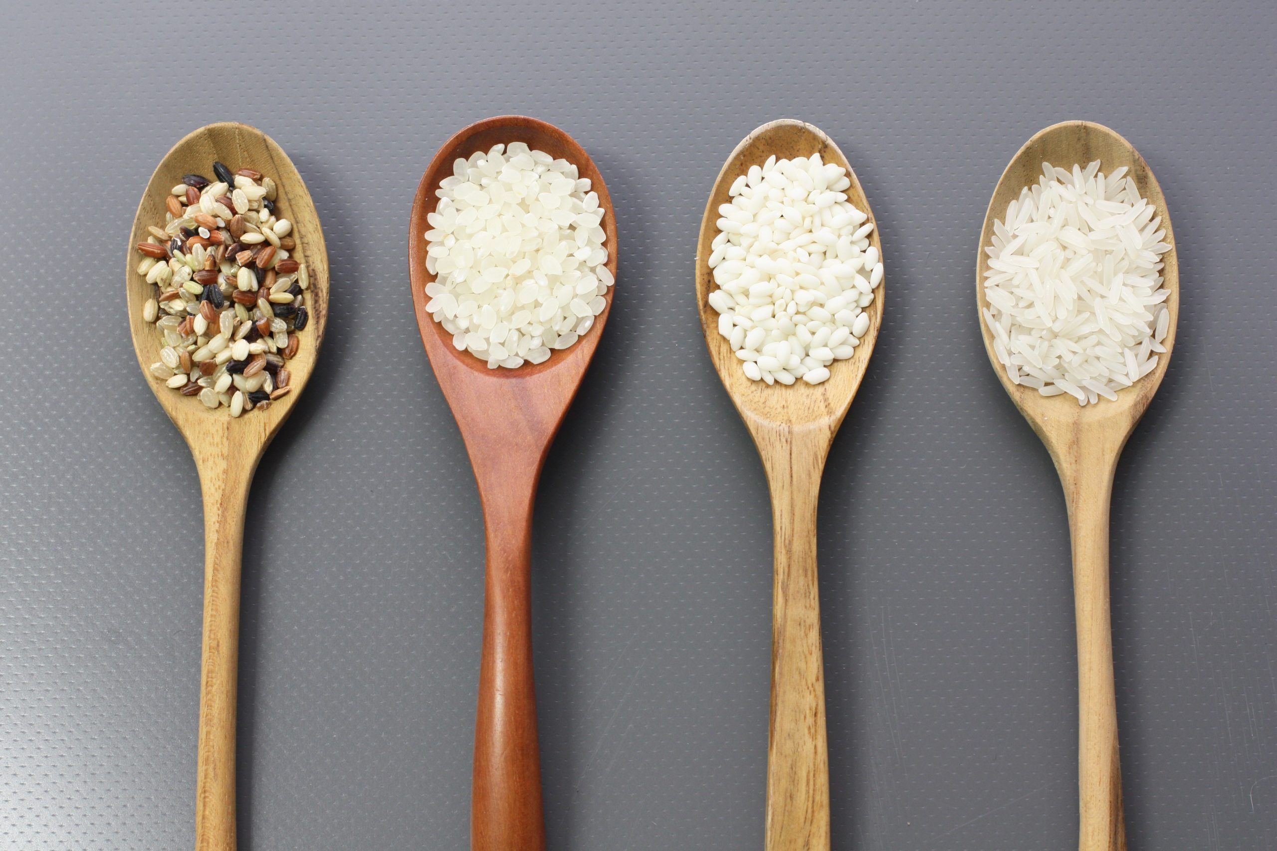 Different types of grains on spoons