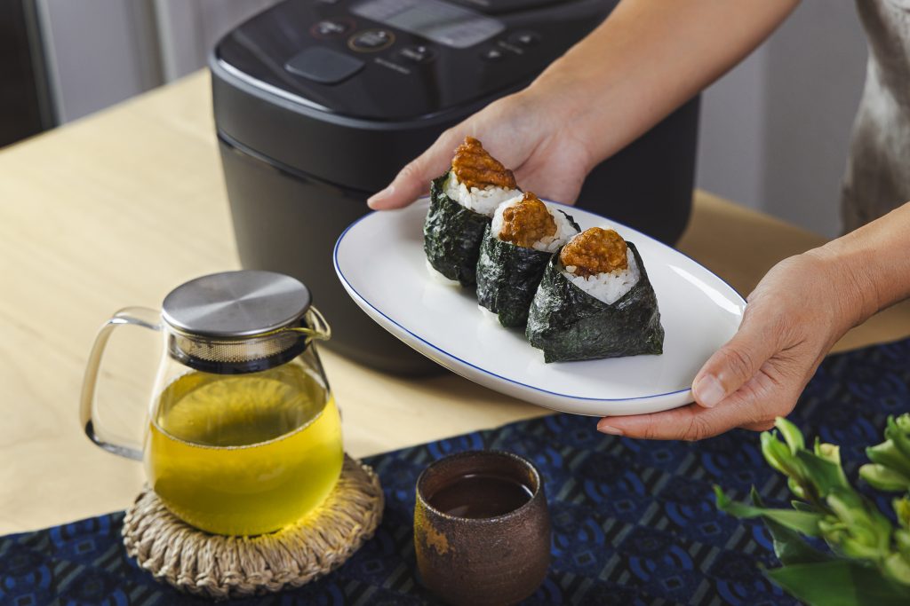 karaage onigiri with tea and rice cooker in the back