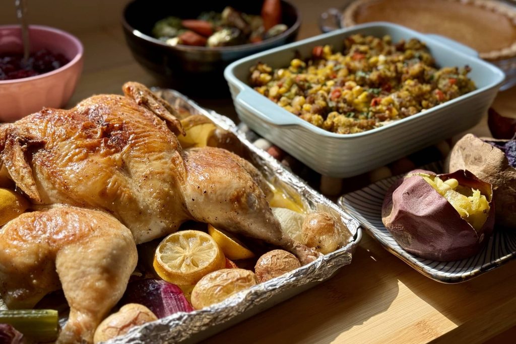 Thanksgiving feast: roast chicken, sweet potato, stuffing, roast vegetables, pumpkin pie