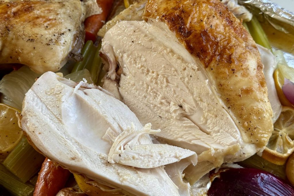 sliced chicken showing juicy insides