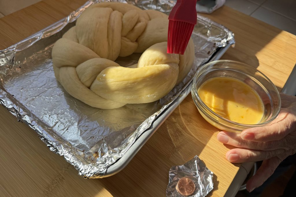 brushing on the egg wash before baking