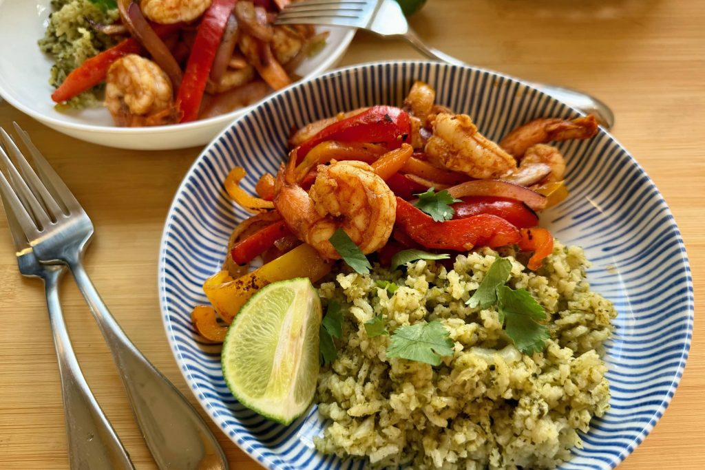Fajita dinner with arroz verde side dish