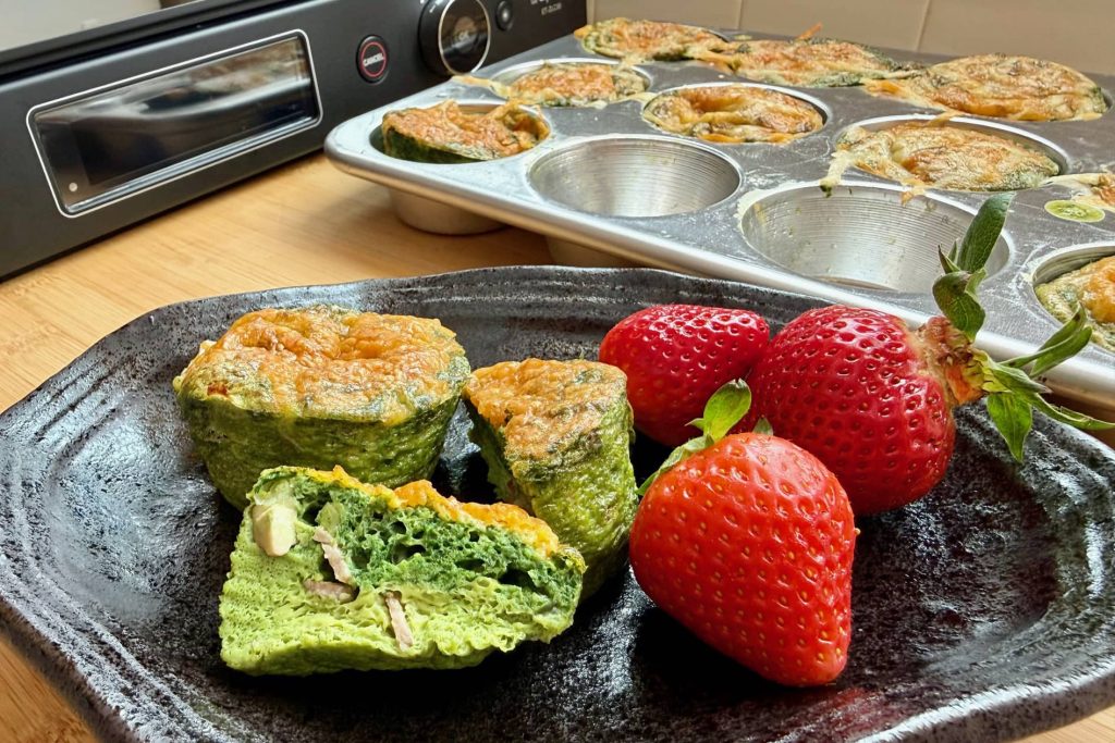 green egg frittata plated with strawberries