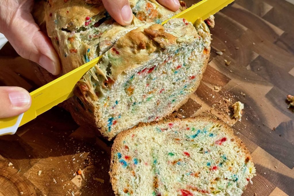 slicing funfetti bread with a knife