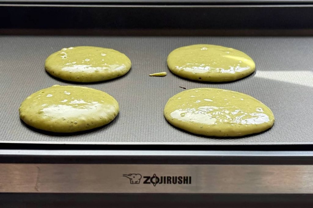 Match pancake batter on griddle