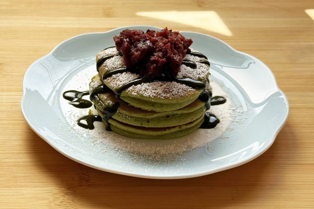 Matcha pancakes topped with sweet red bean paste