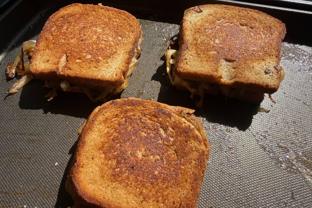 patty melt sandwiches on griddle