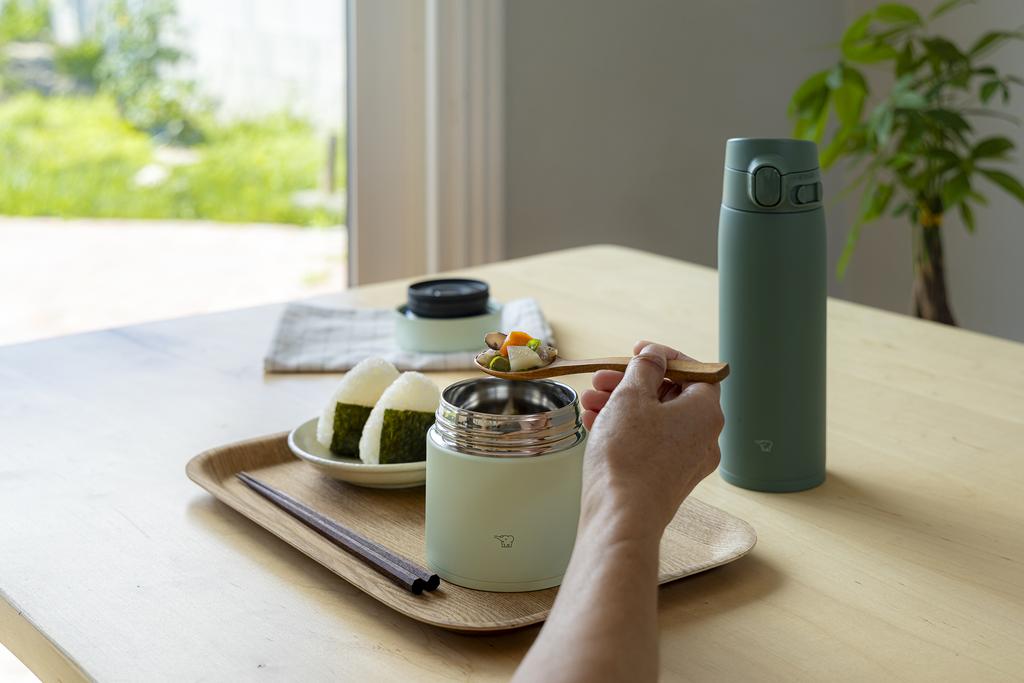 Onigiri next to food jar and bottle