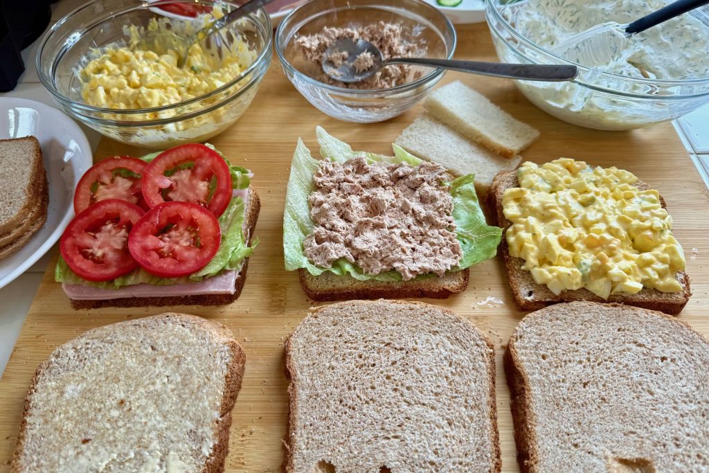 sandwich prep with ham, tuna, egg salad