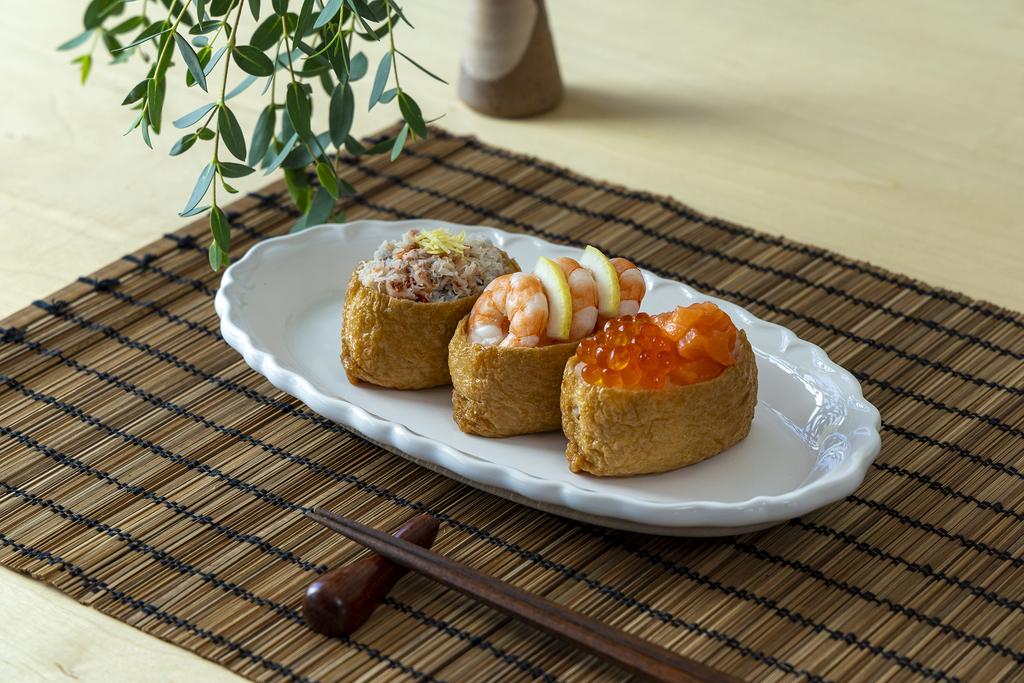 3 inari sushi on the white plate