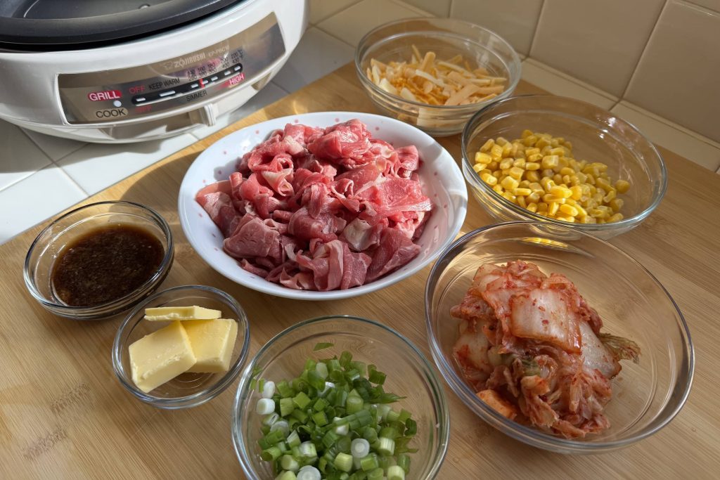 Pepper Rice prep ingredients: beef, sauce, butter, green onion, kimchee, corn, grated cheese